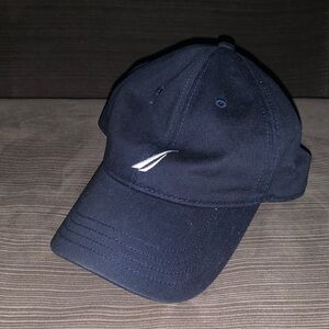 This is a navy blue nautica hat that is lightly worn.